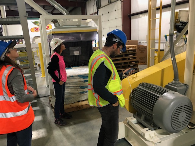 workers inspecting industrial equipment img