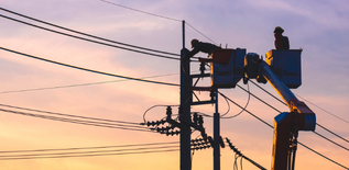 men attaching an emf sensor to a power line